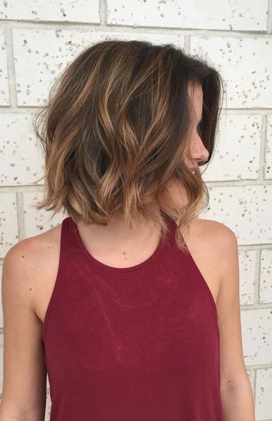 A black bob with caramel balayage and waves is a beautiful and eye catchy idea with plenty of contrast