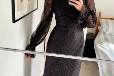 a black lace midi dress with a high neckline, long illusion sleeves, black peep toe shoes for a glam look