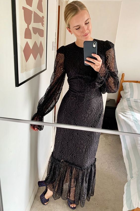 a black lace midi dress with a high neckline, long illusion sleeves, black peep toe shoes for a glam look