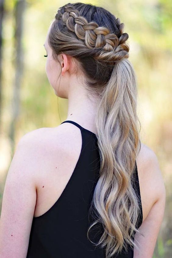 a boho high ponytail paired with a loose braid halo is a cool and bold idea for long hair