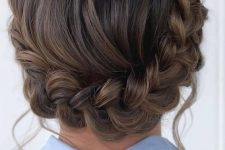 a braided updo with a volume on top is a catchy and stylish idea for a boho or rustic look