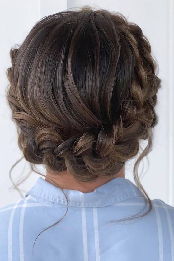 a braided updo with a volume on top is a catchy and stylish idea for a boho or rustic look