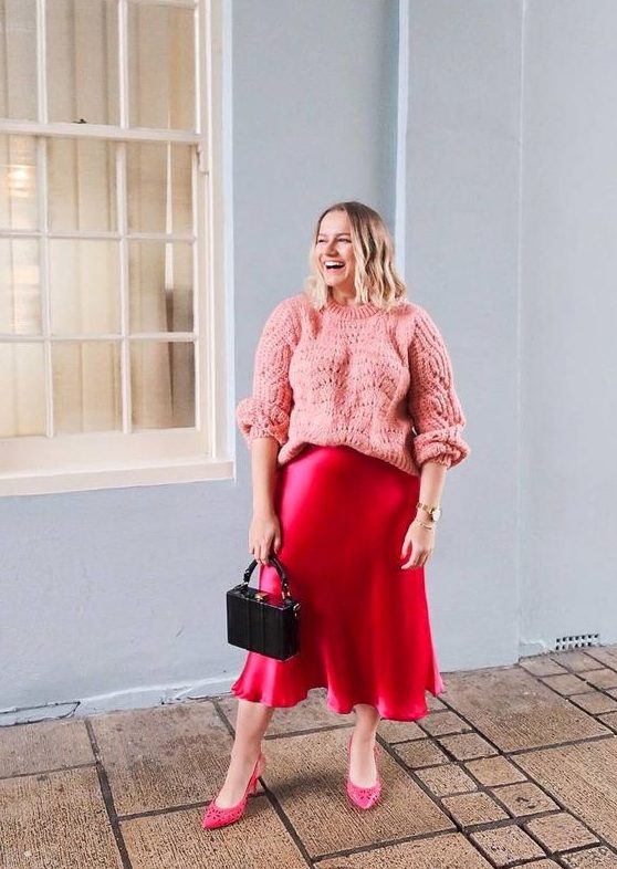 a bright and cute look with a pink oversized jumper, a hot pink slip midi, pink shoes and an elegant small bag