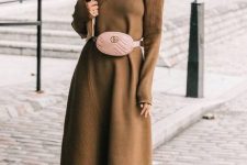 a camel A-line midi knit dress with a turtleneck, long sleeves, a blush waist bag and purple sock boots