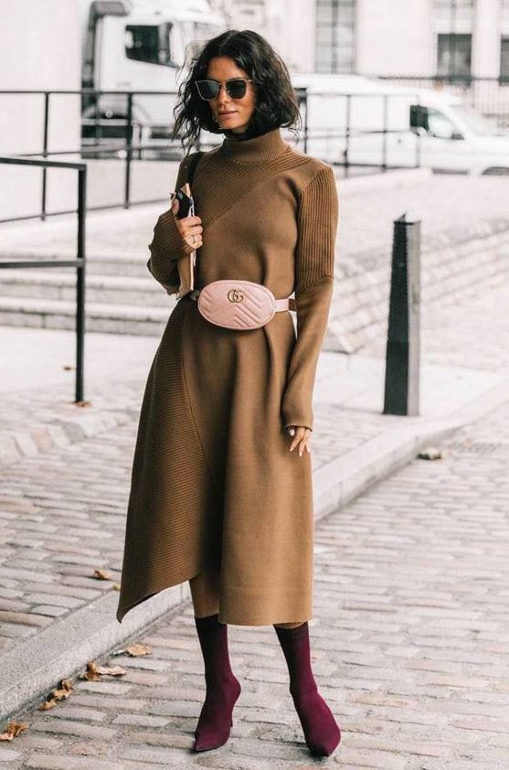 A camel A line midi knit dress with a turtleneck, long sleeves, a blush waist bag and purple sock boots