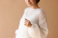 a casual white bridal shower outfit with a white sweater, a plain white skirt and a top under the sweater is simple and cool