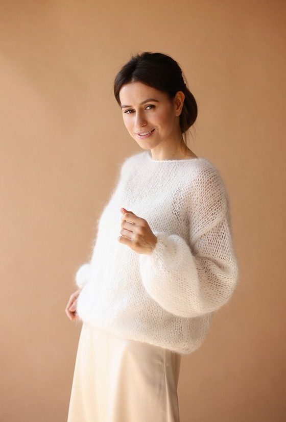 a casual white bridal shower outfit with a white sweater, a plain white skirt and a top under the sweater is simple and cool