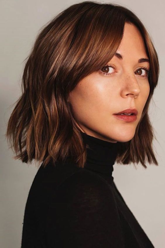 a catchy long chestnut bob with slight waves and volume is a cool solution for a bold and lovely look
