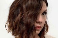 a catchy midi wavy chestnut bob with a delicate balayage, waves and volume, is a stunning and cool idea