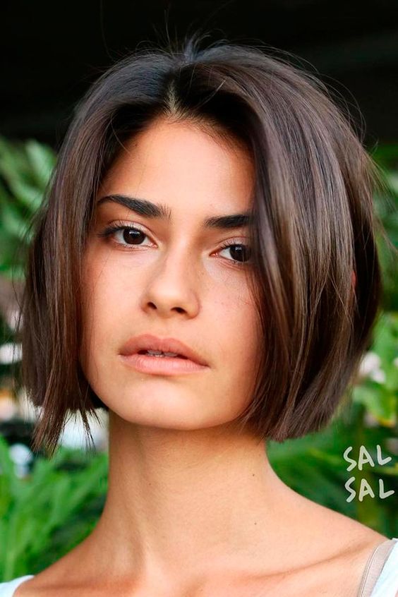 a chin-length chestnut bob with a lot of volume looks eye-catchy and very cool and bold