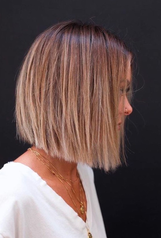 a cihc blunt bob with a brown root and blonde balayage is a beautiful and catchy idea to try right now