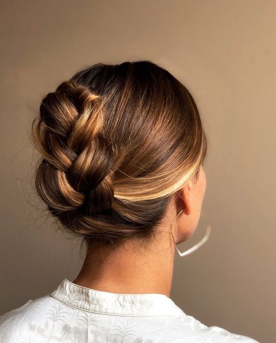 a classy braided updo with a sleek top is a cool and catchy idea even if your hair isn't look