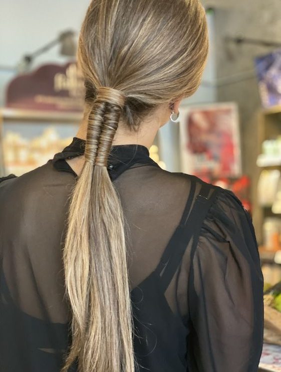 a creative modern wrapped ponytail with a sleek top is a lovely idea for a modern and edgy look