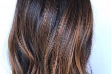 a dark brunette, almost black long bob, with caramel balayage and a bit of texture is a lovely idea to rock