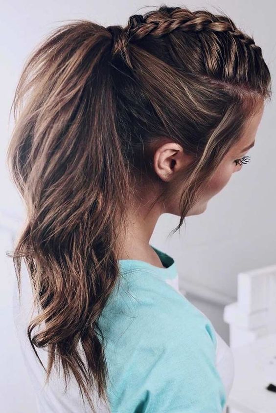 A high ponytail with a braid on top and waves and face framing locks is a cool idea for the holidays