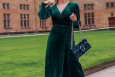 a lovely winter wedding guest look with a dark green velvet midi dress, black boos and a black bag