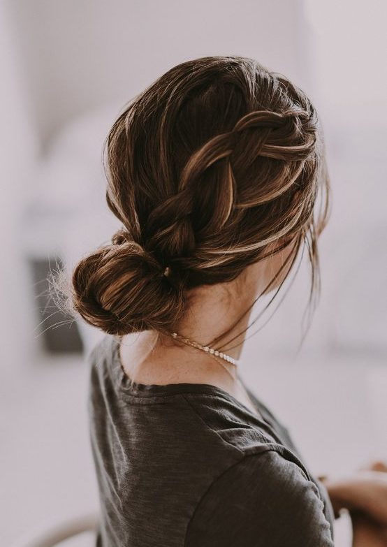 a low bun with a large sided braid is a comfy and long-lasting hairstyle with a casual feel