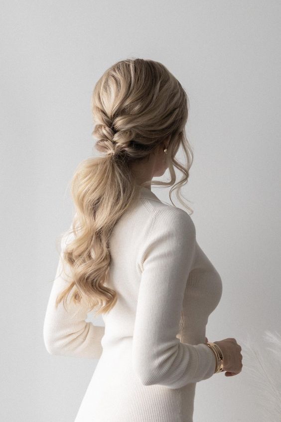 a low ponytail with a small braided touch and a volume on top plus face-framing hair is amazing for a party