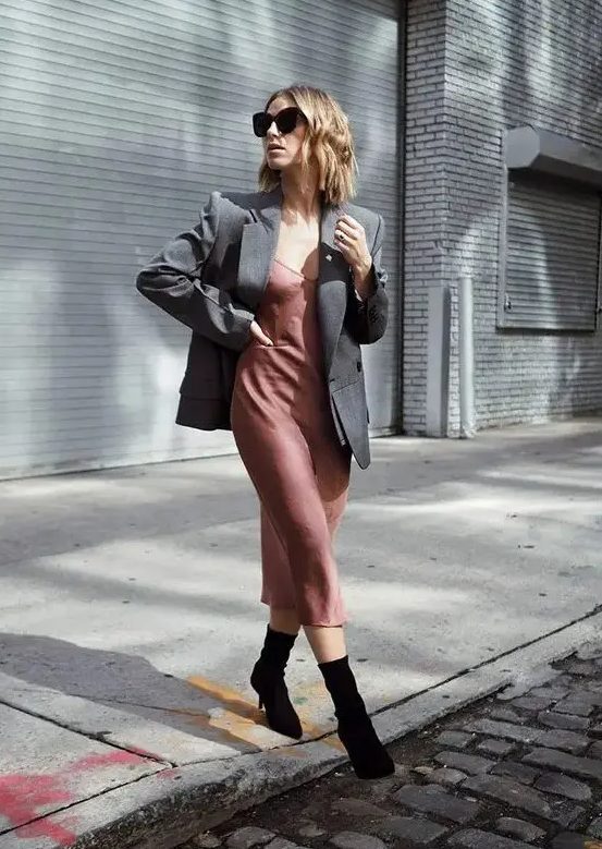 a mauve slip midi dress, a grey oversized blazer, black sock boots for a relaxed and minimal guest outfit