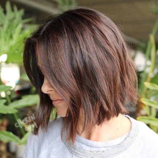a messy midi length wavy bob in chestnut shades is a cool and catchy idea to try right now