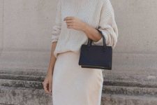a pretty and simple bridal shower look with a sweater, a silk slip skirt, a black mini bag and statement earrings