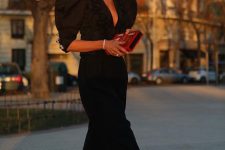 a refined black jumpsuit with puff sleeves, a deep neckline, cropped pants, black slingbacks and chic accessories