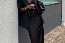 a refined minimalist wedding guest look with a slip midi dress, an oversized blazer, black shoes and a bag