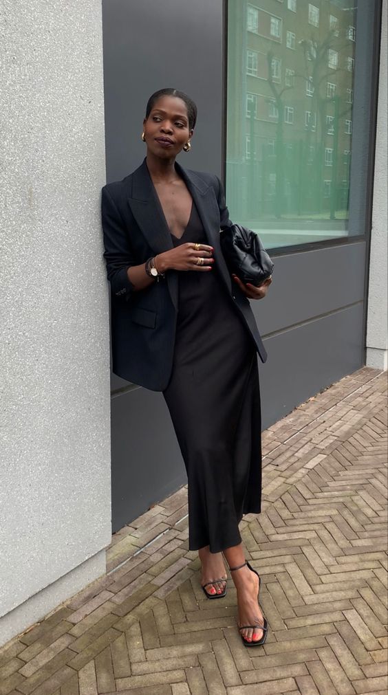 a refined minimalist wedding guest look with a slip midi dress, an oversized blazer, black shoes and a bag
