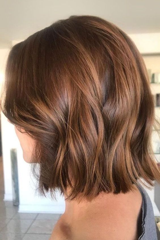 a stylish chesntut midi bob with caramel balayage and waves is a cool and chic solution