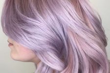 a subtle and chic lilac rose long bob with waves and face-framing layers is very beautiful