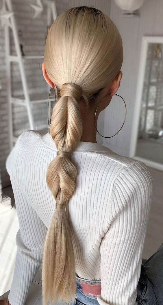 a super creative twisted low ponytail or a through bubble braid is a chic and cathcy idea for a holiday party