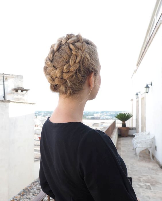 a tight braided updo will keep you picture-perfect all day long and it looks cool and boho-inspired