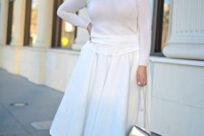 a white A-line midi skirt, a white illusion neckline top, wihte heels and a silver bag for a party