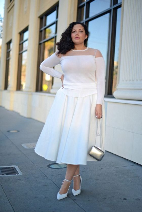 A white A line midi skirt, a white illusion neckline top, wihte heels and a silver bag for a party