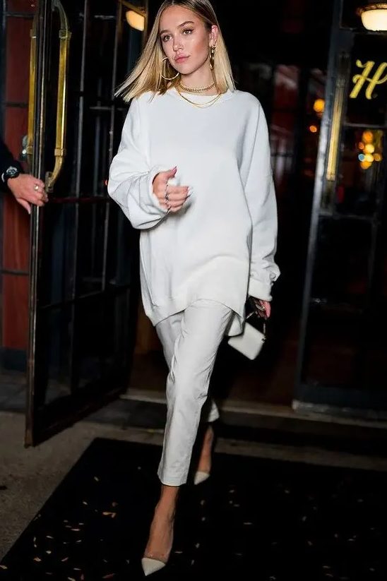 a white oversized sweatshirt, skinny pants, white semi sheer shoes and a mini bag for a lovely fall bridal shower