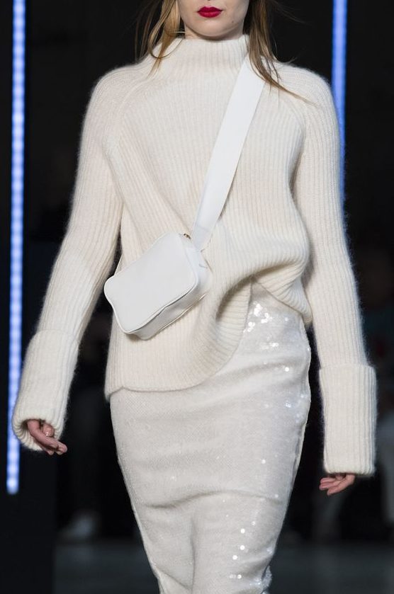a white turtleneck sweater, a white sequin skirt and a small crossbody bag for a beautiful look