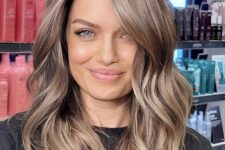 beautiful light brown medium-length hair with a slight ombre effect, with waves and a shiny finish is amazing