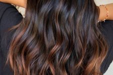 bold brew wavy hair with copper and chestnut balayage starting in the middle to give interest and dimension to the hair