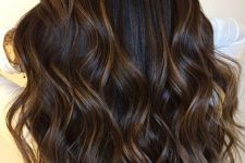 cold brew hair with light caramel and honey bangs plus waves looks dimensional, textural and interesting