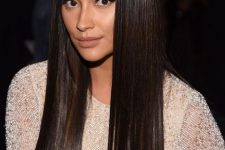 extra long and shiny dark brown hair straightened and with a glossy finish is a catchy and cool idea to rock