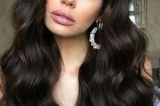extra long and volumetric dark brown hair in a cold shade, with waves, is a stunnign and catchy idea to rock
