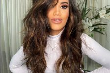 extra long and volumetric dark brown hair with copper and chestnut balayage, with messy waves is a cool idea to wow everyone
