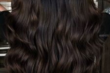 extra long dark brown hair with a lot of volume, waves and a slight touch of color is an amazing idea to rock