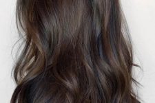 extra long dark brown hair with dark chestnut balayage that gives dimension to the hair and catches an eye