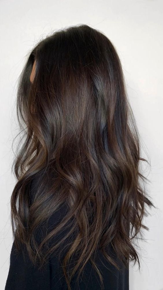 extra long dark brown hair with dark chestnut balayage that gives dimension to the hair and catches an eye