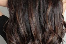 extra long volumetric dark brown hair with chestnut balayage, with waves, looks elegant and chic and catches an eye