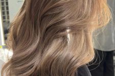 gorgeous long light brown hair with caramel balayage, waves and volume is a chic and beautiful idea