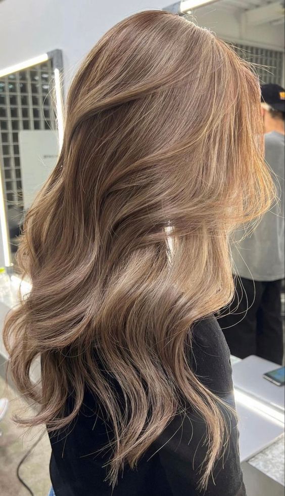 gorgeous long light brown hair with caramel balayage, waves and volume is a chic and beautiful idea