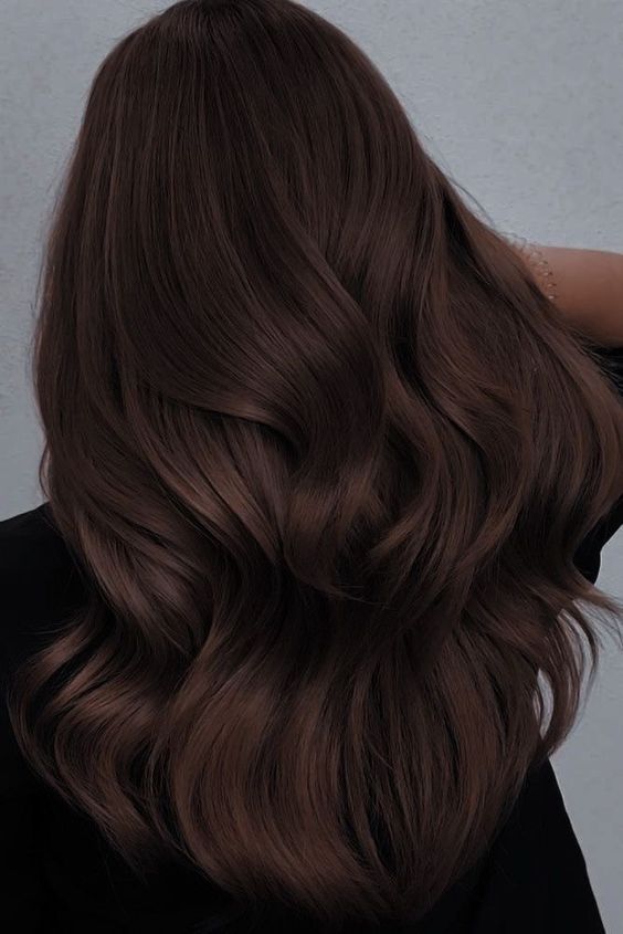 Jaw dropping long and volumetric dark brown hair with waves is a fantastic idea to rock, show off your gorgeous locks