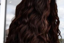 jaw-dropping long dark brown volumetric hair with waves just brings that wow factor and inspires to try the color